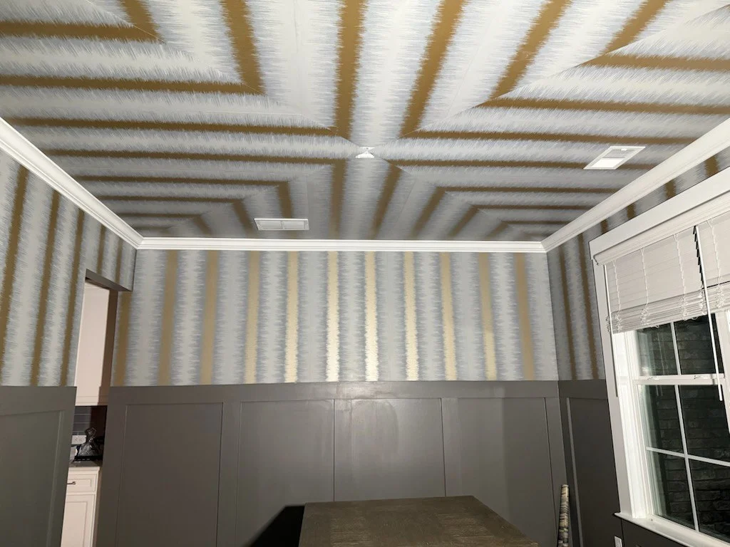 Professional wallpaper hanger applying wallcovering in San Francisco
